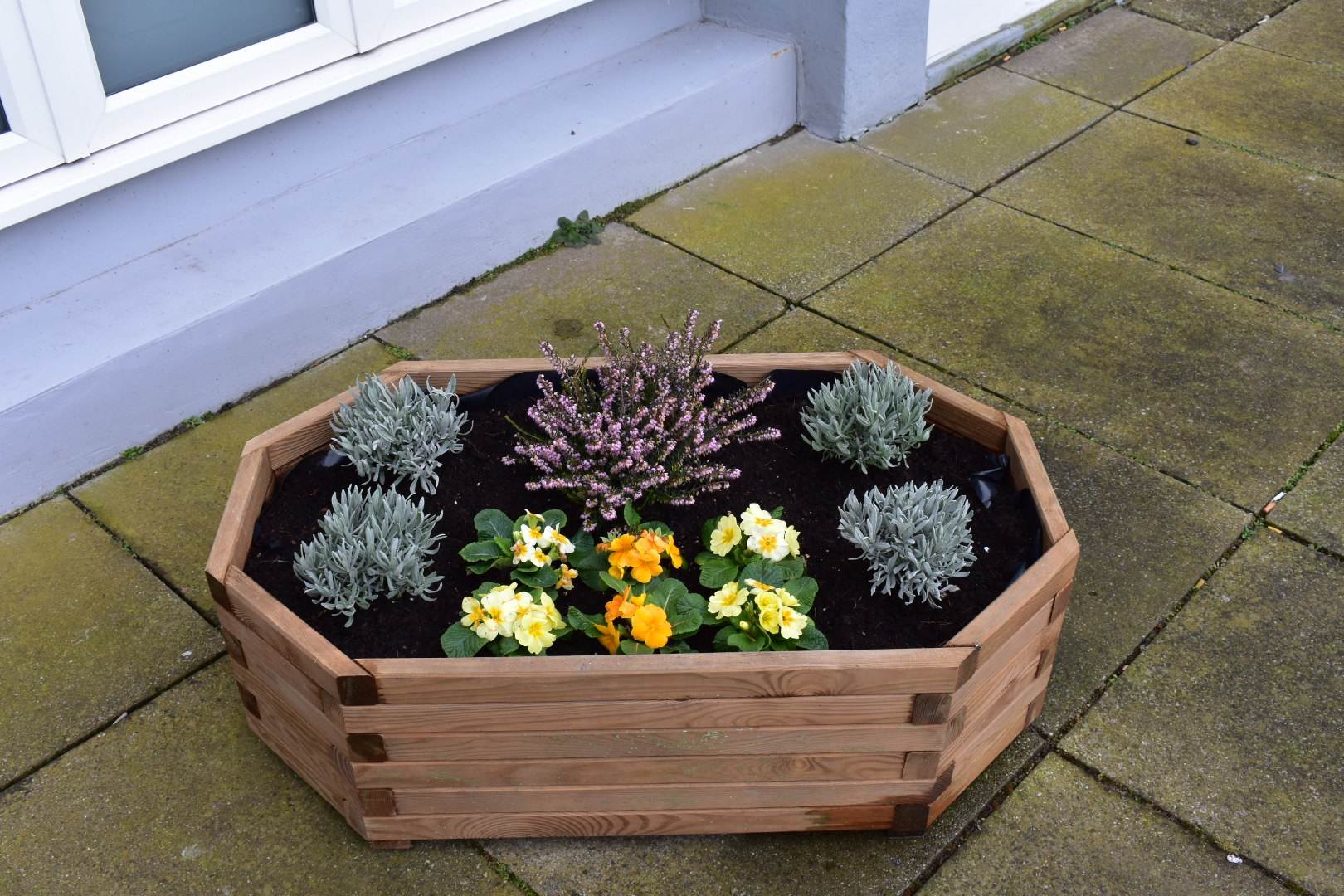 wooden planter with flowers